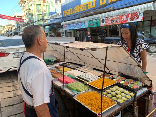 Thailand - Chiang Rai - Desert street food vendor with our guide Iris in Chiang Khong Main Street.