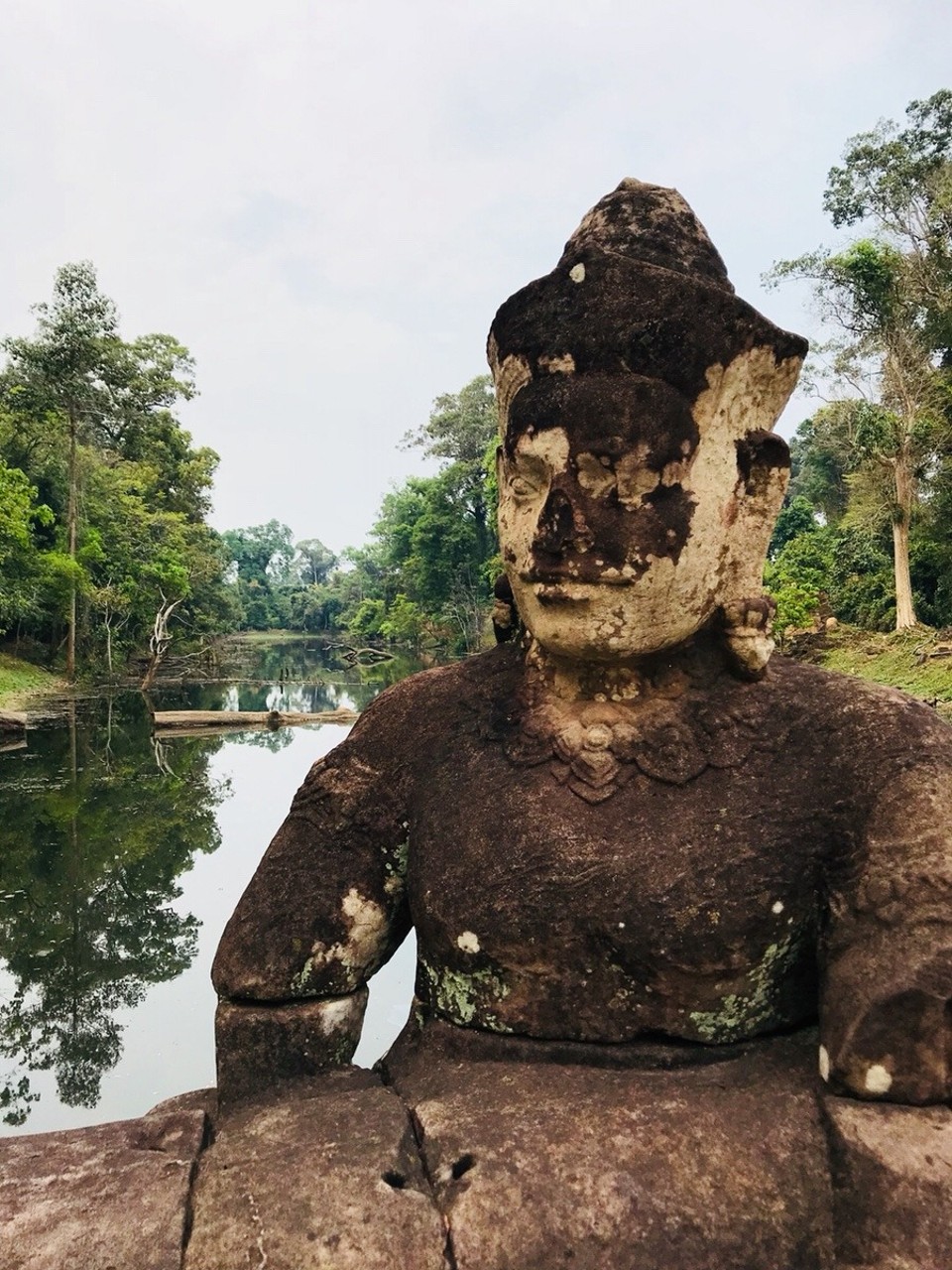 Cambodia - Siem Reap - One of the remaining figure heads at Preah Khan gateway which was not destroyed by the KR