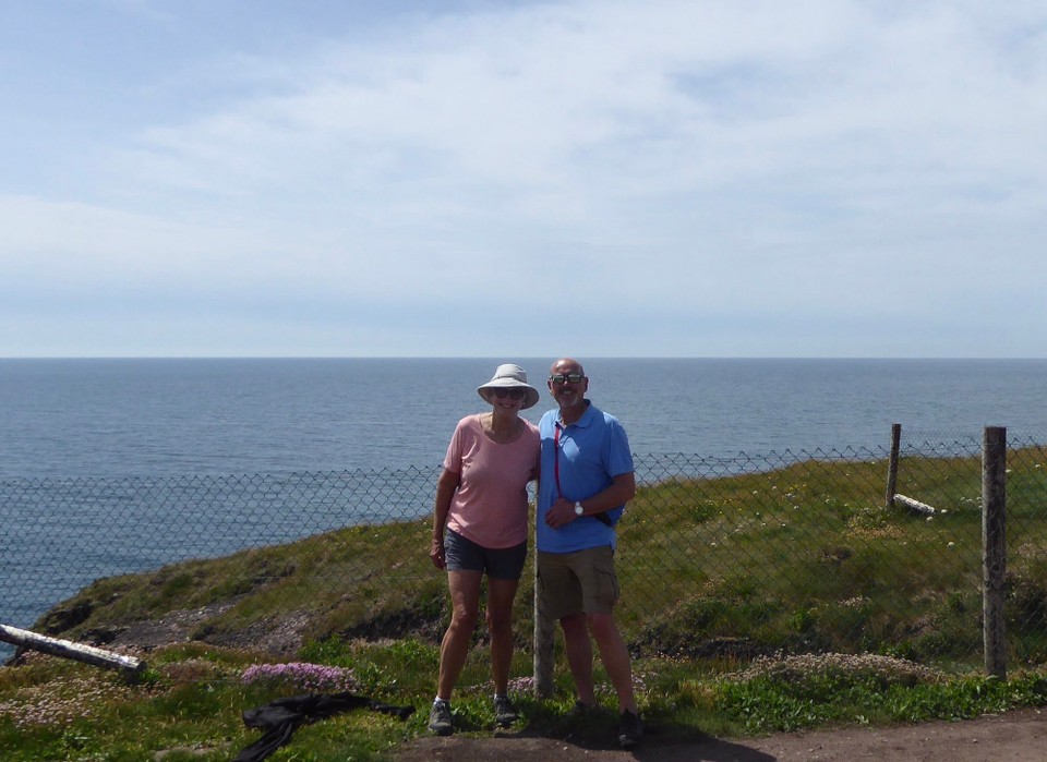 Ireland - Dunmore East - A shocking time setting up our selfie! I decided to use a fence post to rest the camera on, but when I leant over to check the viewfinder, I discovered it was an electric fence. Ouch.