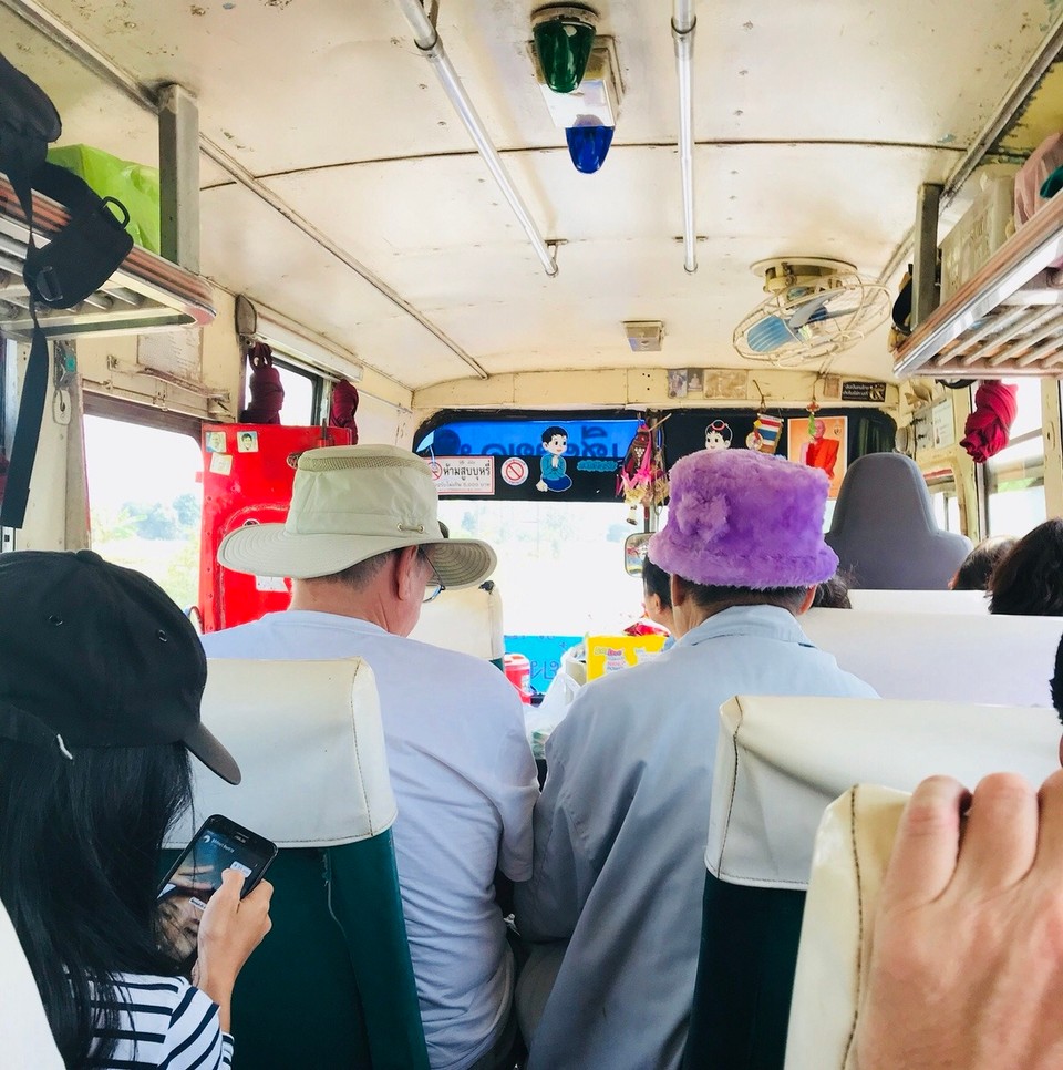 Thailand - Chiang Rai - Strange bus attire travelling from Chiang Rai to Chiang Khong