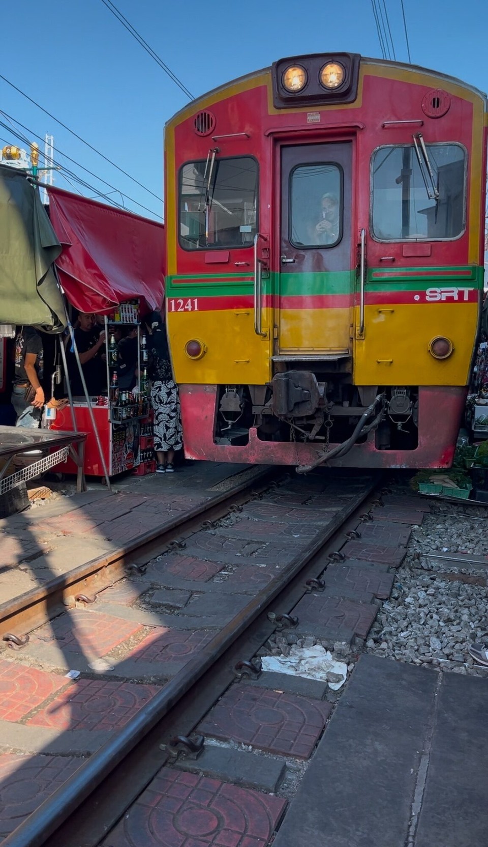 Thailand - Bangkok - The railway market was so overcrowded and not for tall people like me 😂, lots of ducking and crouching going on. The market was mainly selling fish which stank, I wouldn’t trust eating it 😅. The train passes every hour, we saw it pass at 2.30pm. 
