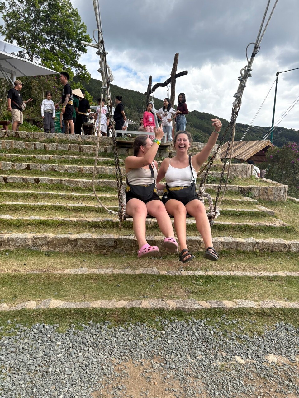Vietnam - Da Lat - We then went on the big swing and it was huge. Luckily they strap you in! The man taking the pictures said to put our fingers up but Alyssa thought he meant middle finger so we were crying about this for the whole swing 😂. The people waiting behind us were laughing at how much we were laughing 😂😂