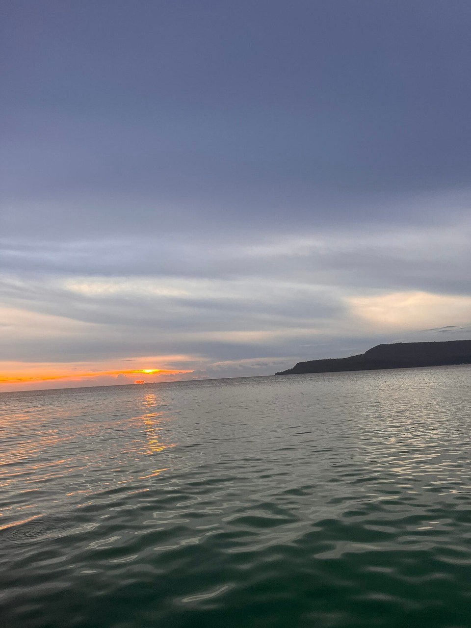 Cambodia - Preah Sihanouk - Sunset was so pretty and then they gave out free whiskey to everyone. We then got into the water when it was dark and saw plankton! What an experience 