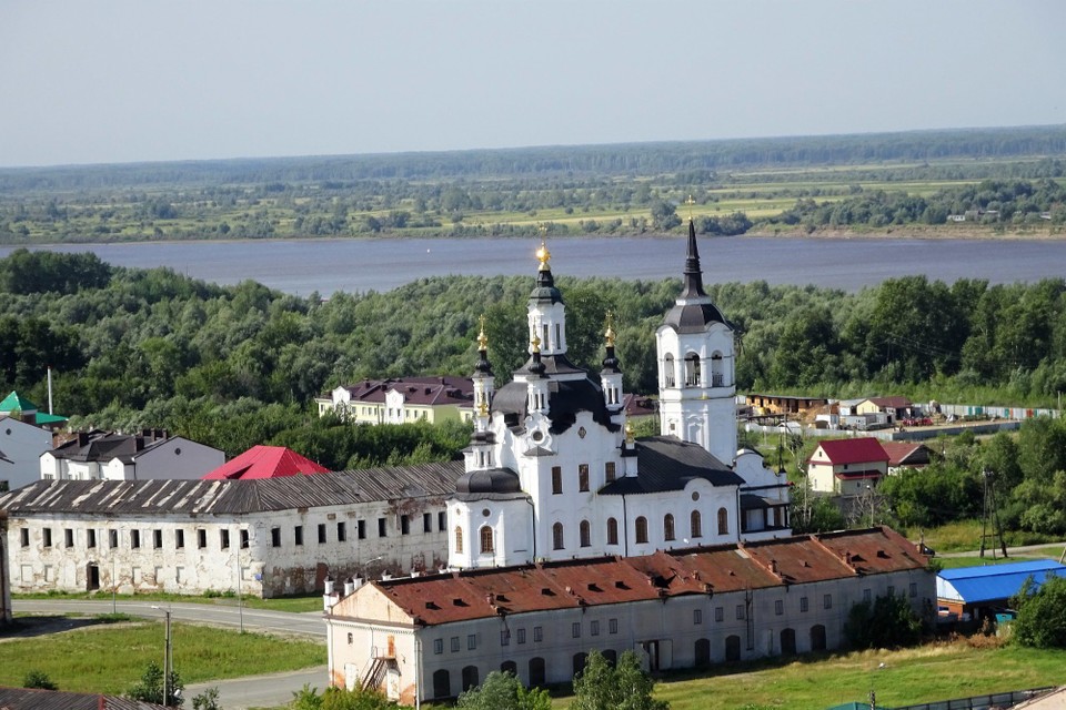 Russia - Tobolsk - The building in front of the church is derelict, but they put a picture on it so it looks good in photos