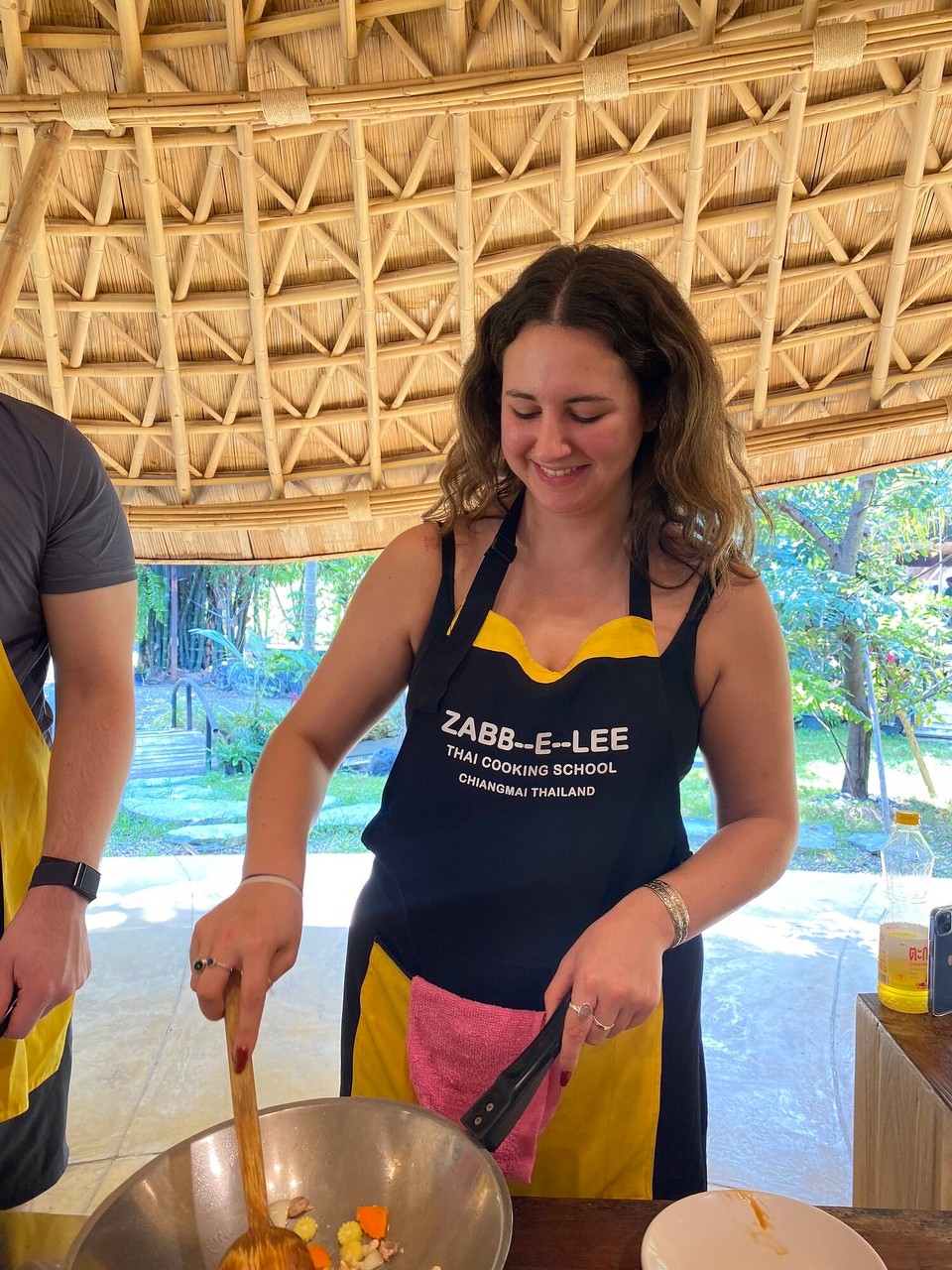 Thailand - Mueang Chiang Mai - A very sleepy Molly smiling and stirring 