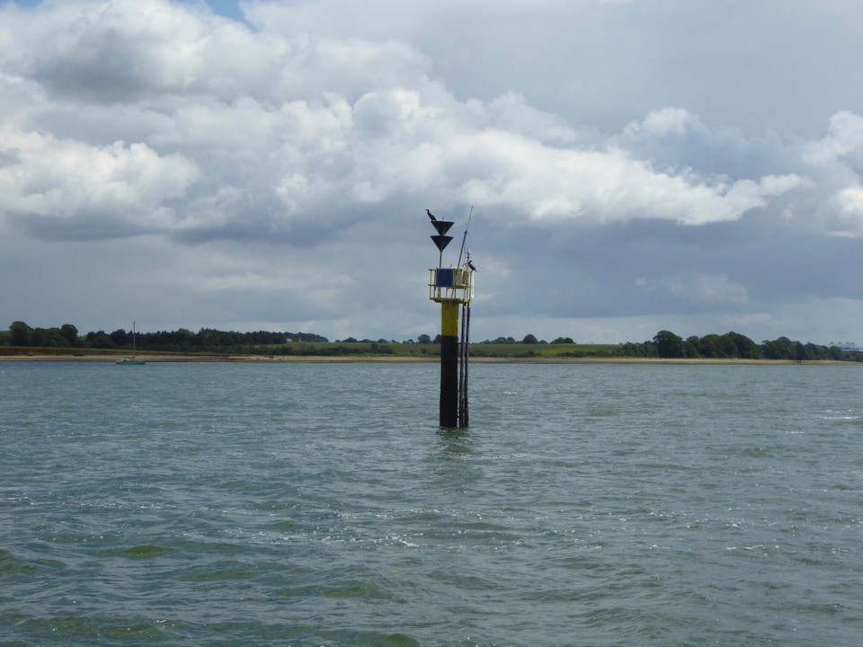 United Kingdom - Woodbridge - South cardinal marking the entrance to Holbrook Bay; a handy spot for cormorants to rest.