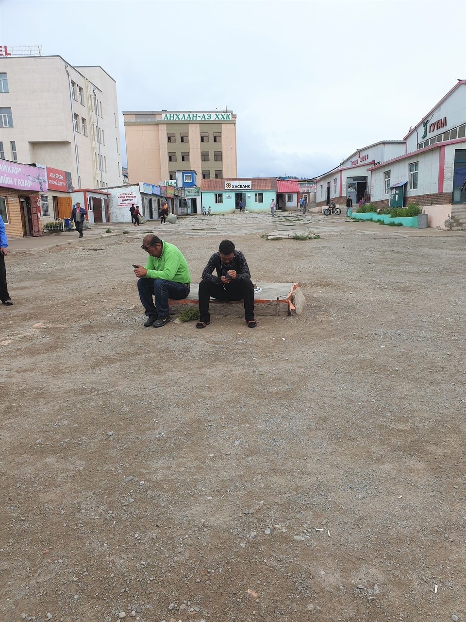 Mongolia - Erdenet - The "thriving" market in Erdenet. Jagga and Taivna were sent to babysit us. I think they worked out we were adults.