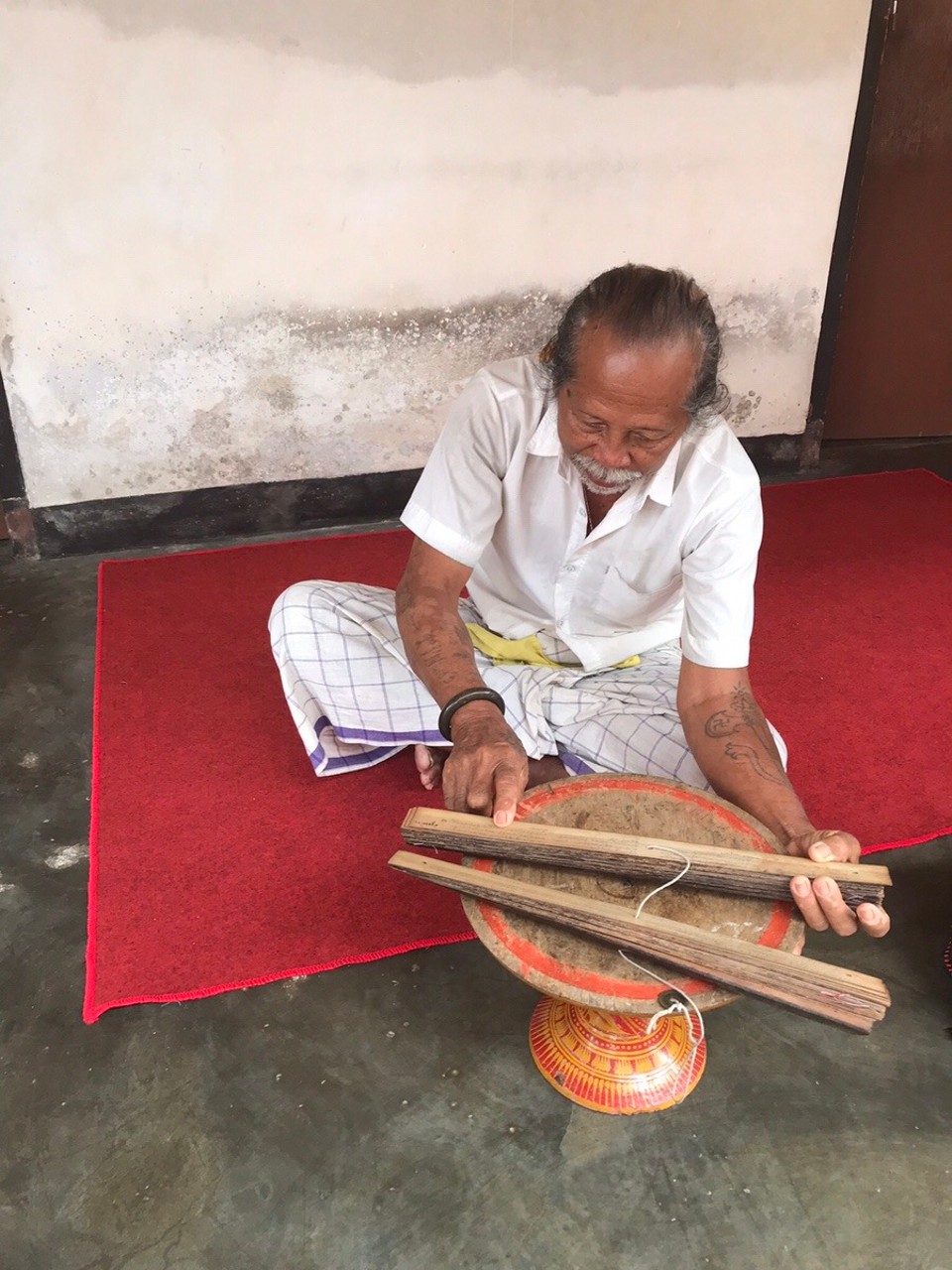 Indonesia - Gianyar - A village elder reading the Indonesian calendar to establish whether it’ll be a good day (it is for me!)