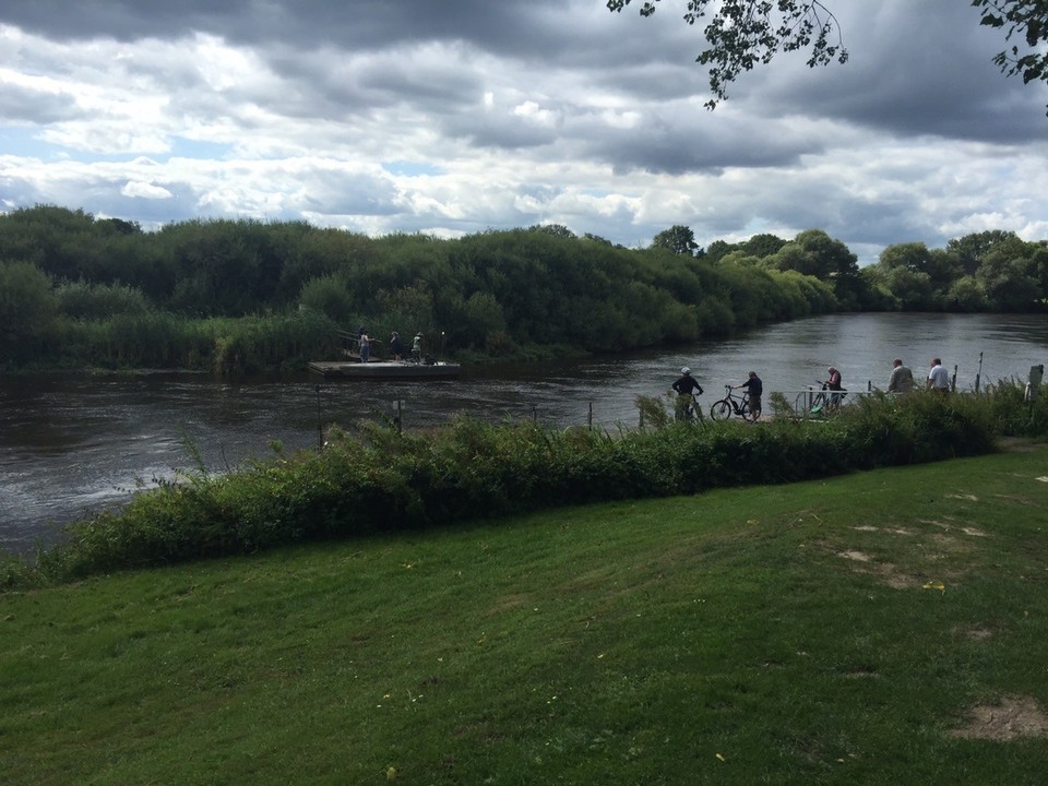 Germany - Lilienthal - View of the River Wümme from the restaurant. Bicycles crossing on the ferry. 