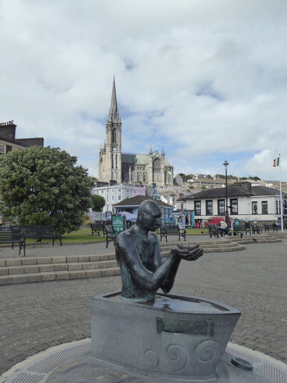 Ireland - Cobh - The Navigator by Mary Gregory, 2019. It depicts a Christ like figure sitting in a boat (some would say a bath tub) cradling a paper boat which represents the fragile nature of our existence. The sculpture represents the guiding force of a benevolent Christ helping people battle life’s storms.