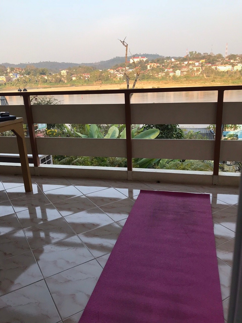 Thailand - Chiang Rai - Yoga on the balcony overlooking the Mekong River at Waterside Lodge