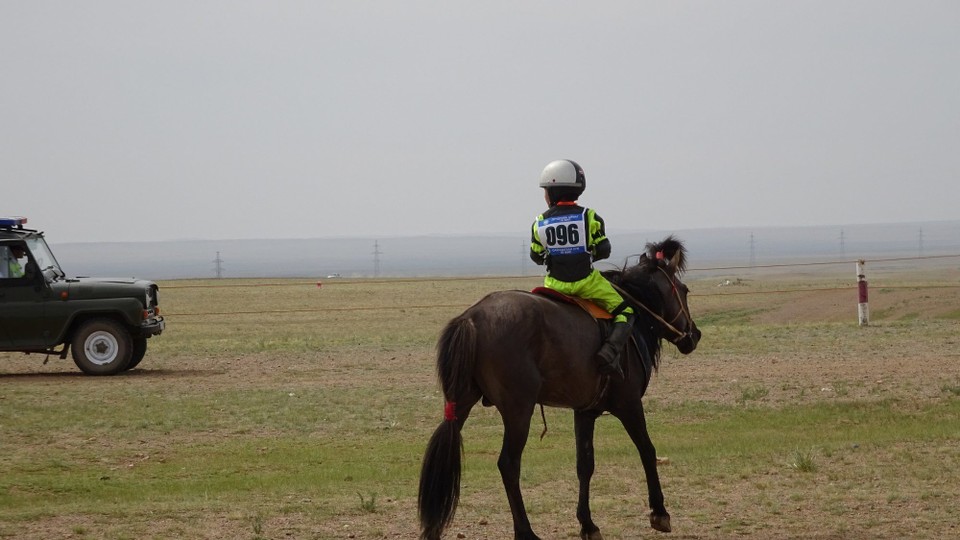 Mongolia - Mandalgovi - Little jockey waiting to meet his family after the race