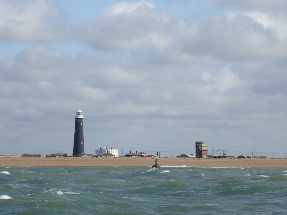 United Kingdom - Eastbourne - There have been 8 lighthouses at Dungeness, 5 main and 3 subsidiary lights. The latter were necessary owing to the constant accretion of shingle on the spit, which leaves the lighthouse further from the sea. Wyatt’s tower, built in 1792, has keepers’ dwellings (the white building) on the site.