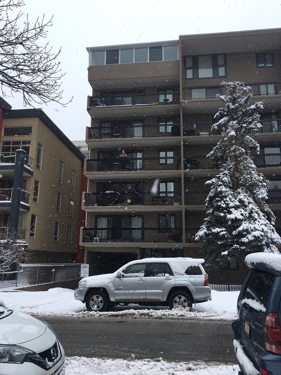 Canada - Calgary - Crazy kid in singlet on the balcony