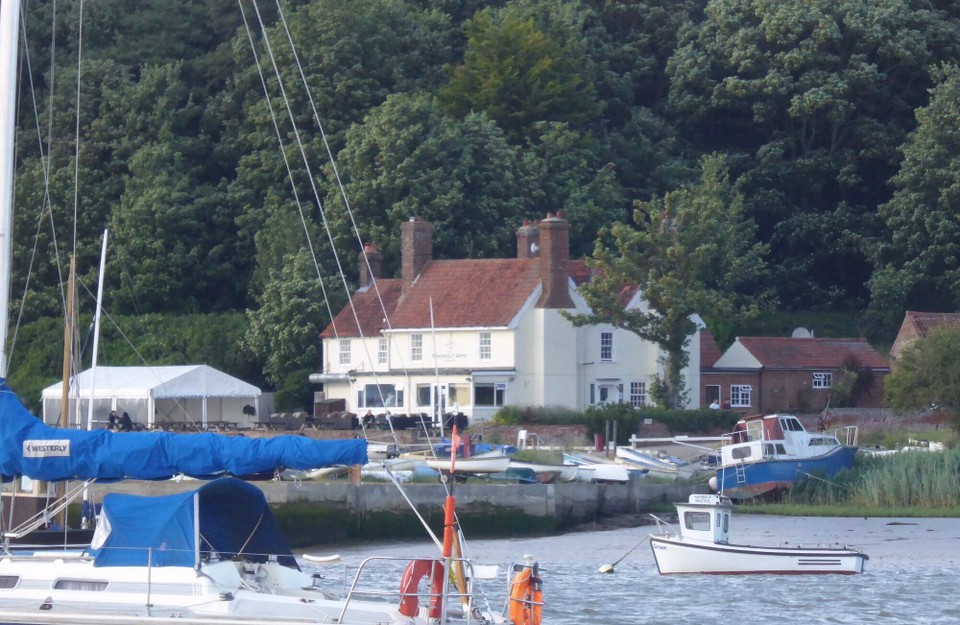 United Kingdom - Woodbridge - Having enjoyed lunch on the patio, we returned to pick up a mooring buoy for the night just opposite - not easy in strong wind and tide. A former shooting lodge called Ferry House, The Ramsholt (pronounced Rams Holt) Arms opened in 1908 when the licence was transferred from the nearby Dock Inn. 