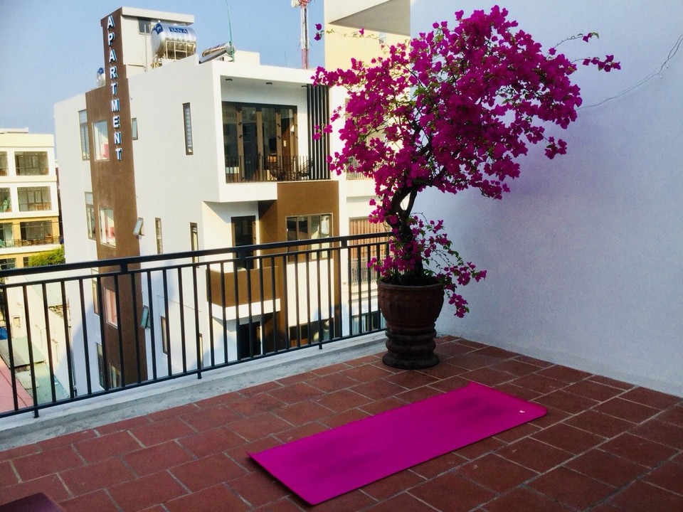 Vietnam - Hoi An - Yoga on the rooftop overlooking Da Nang
