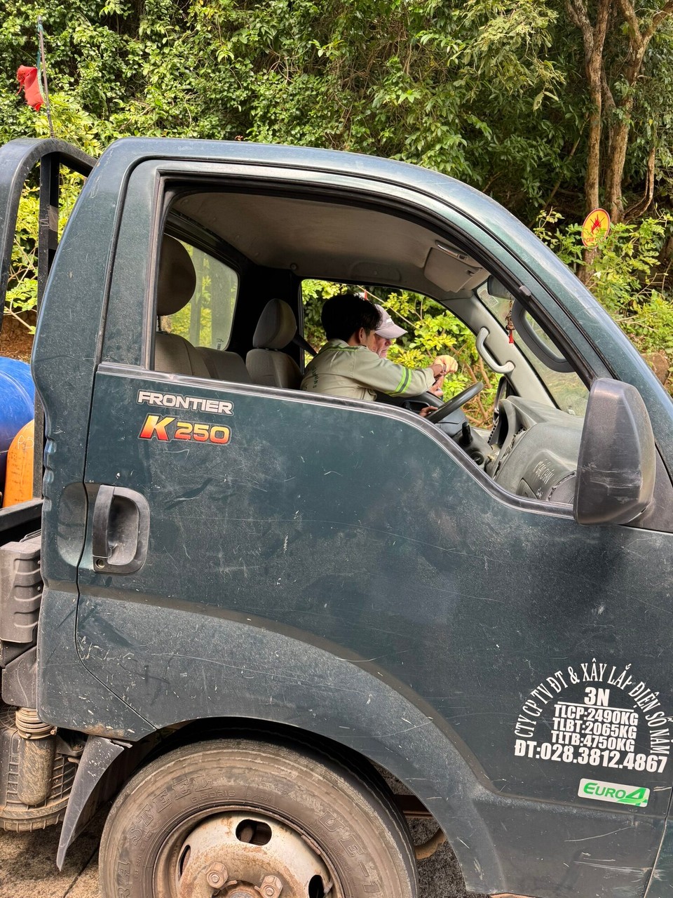 Vietnam - Con Dao - A guy stops and offers us a lift back down the mountain, welcome relief in the heat 