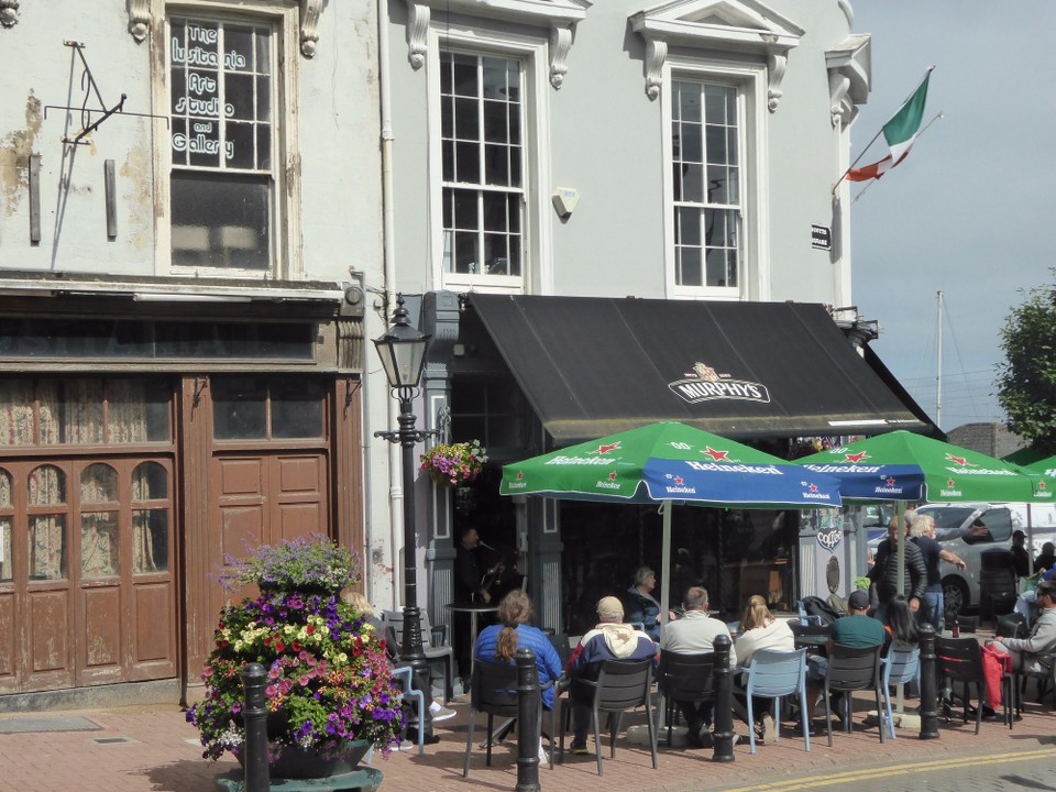 Ireland - Cobh - We managed to find seats, so decided to stop for a drink (Guinness of course) at the Mauritania and listen to the singer performing from a doorway.