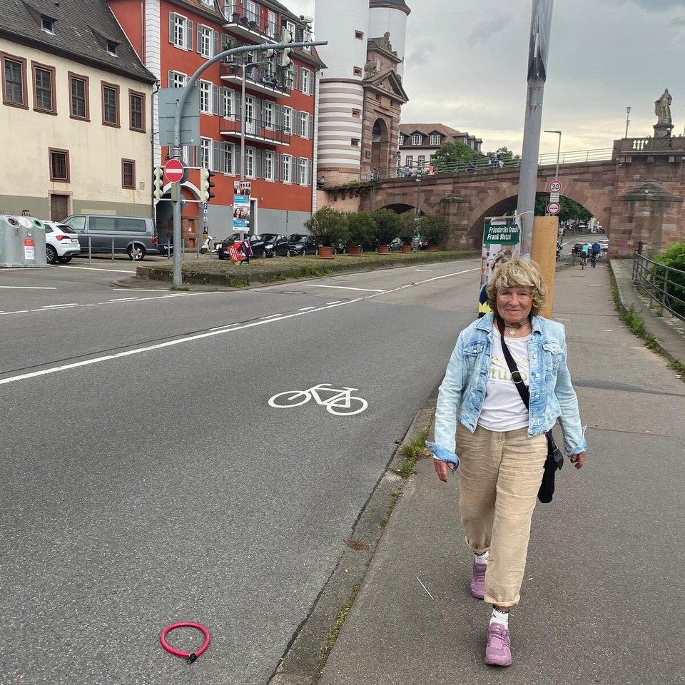 Deutschland - Heidelberg - Me walking on Neckarside. 
Background the historical Bridge