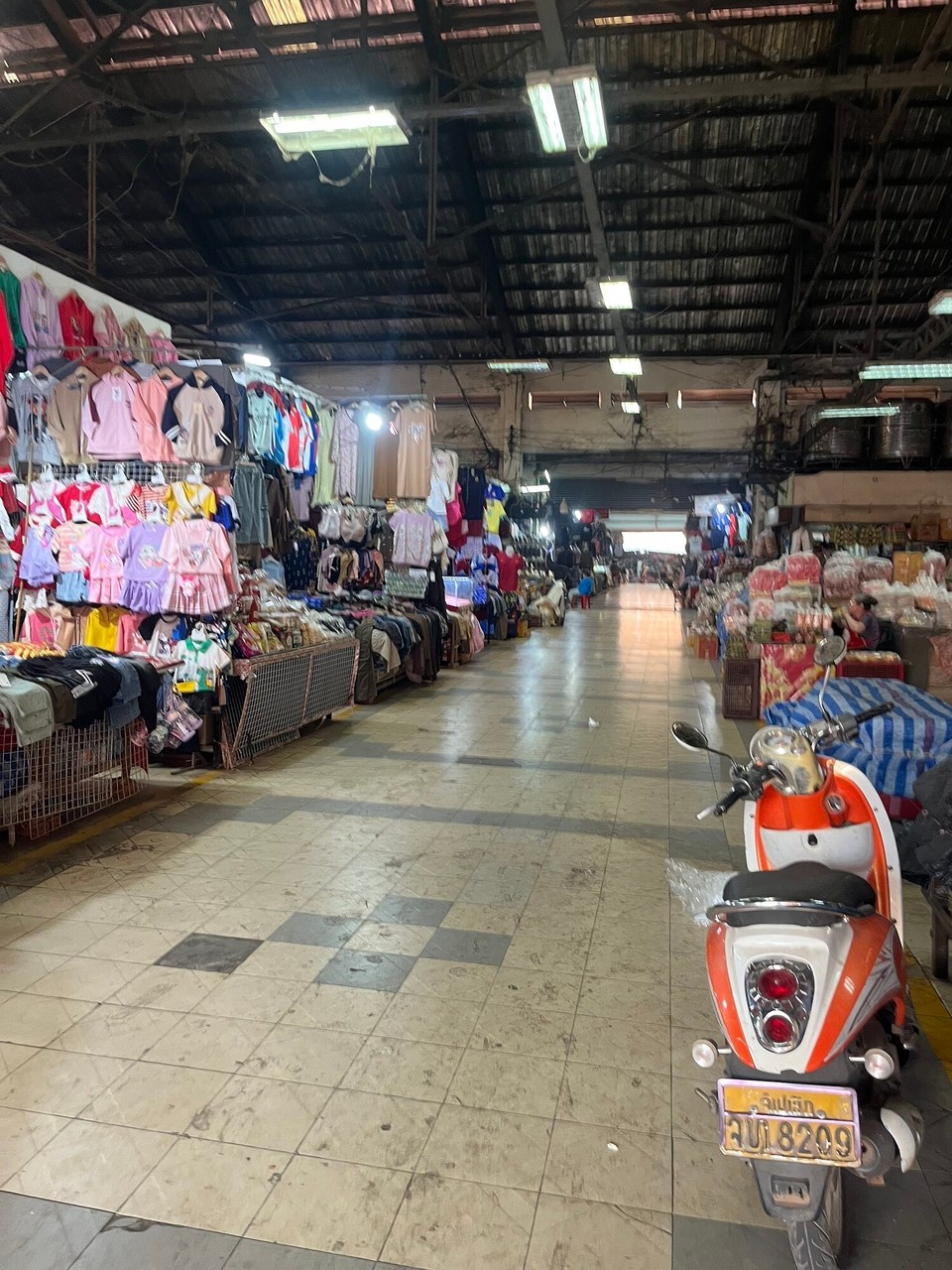 Laos - Pakse - I’ve been looking for a Chang football shirt for a while but can’t find them in Laos. We had a look around the shops but the clothes are all so small :(. We then found a jersey shop on the way home and I found the oasis x Man City top for £5! Bargain!