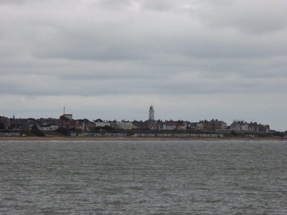 United Kingdom - Southwold - Southwold with its lighthouse nestled in its centre. Mentioned in the Domesday Book (1086), it was a fishing and trading port. Over the centuries a shifting shingle bar at the mouth of the harbour prevented it from becoming a major modern port.