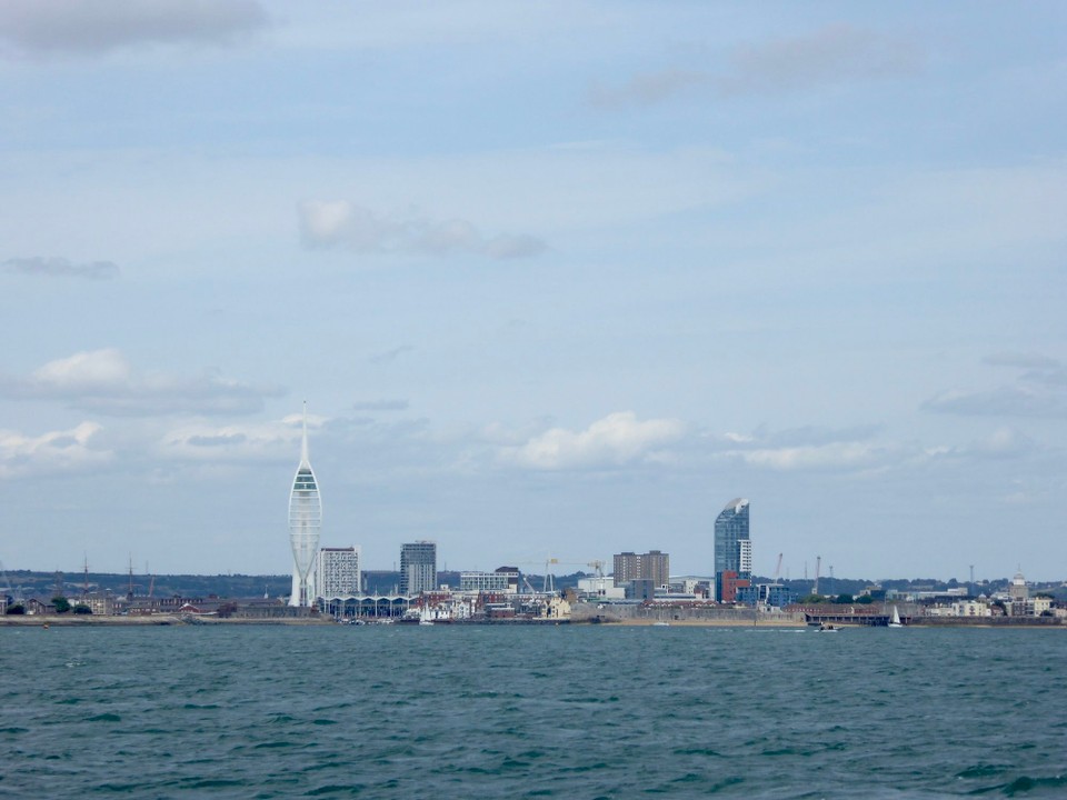 United Kingdom - Southsea - Sailing past Portsmouth with its Spinnaker Tower. Named after the sail, it is a 170 metre landmark observation tower, completed in 2205. During a five year sponsorship deal with Emirates Airline it was repainted, but in April 2021 it returned to its original all white colour.