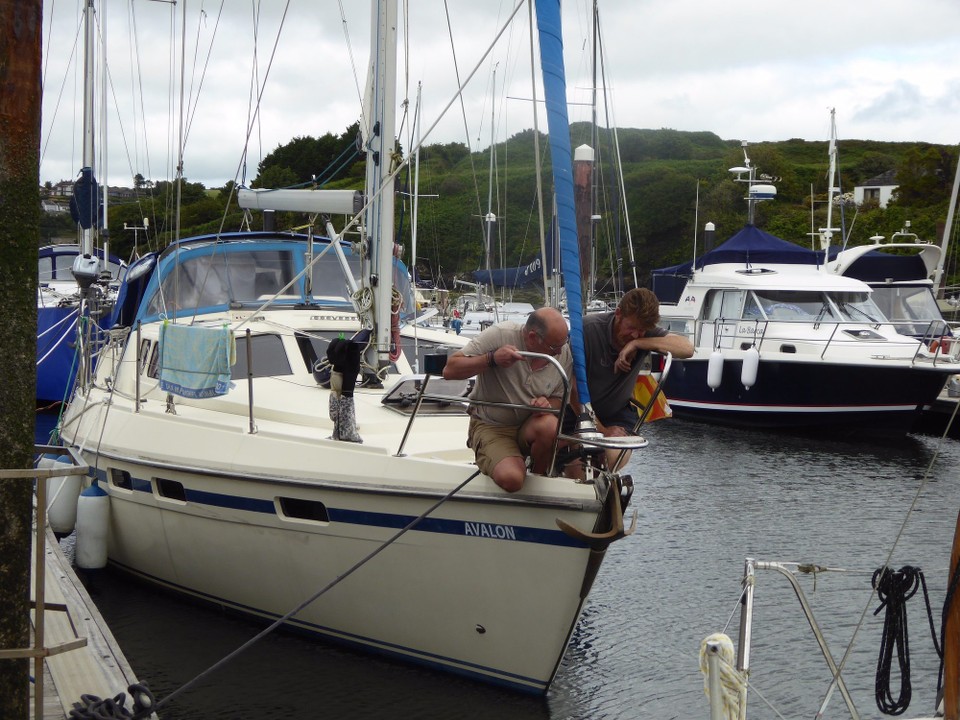 Ireland - Kinsale - Discussing the anchor roller with George Kingston from Kinsale Boatyard. He dropped by to discuss work to be done, and arrange moving Avalon to the yard.