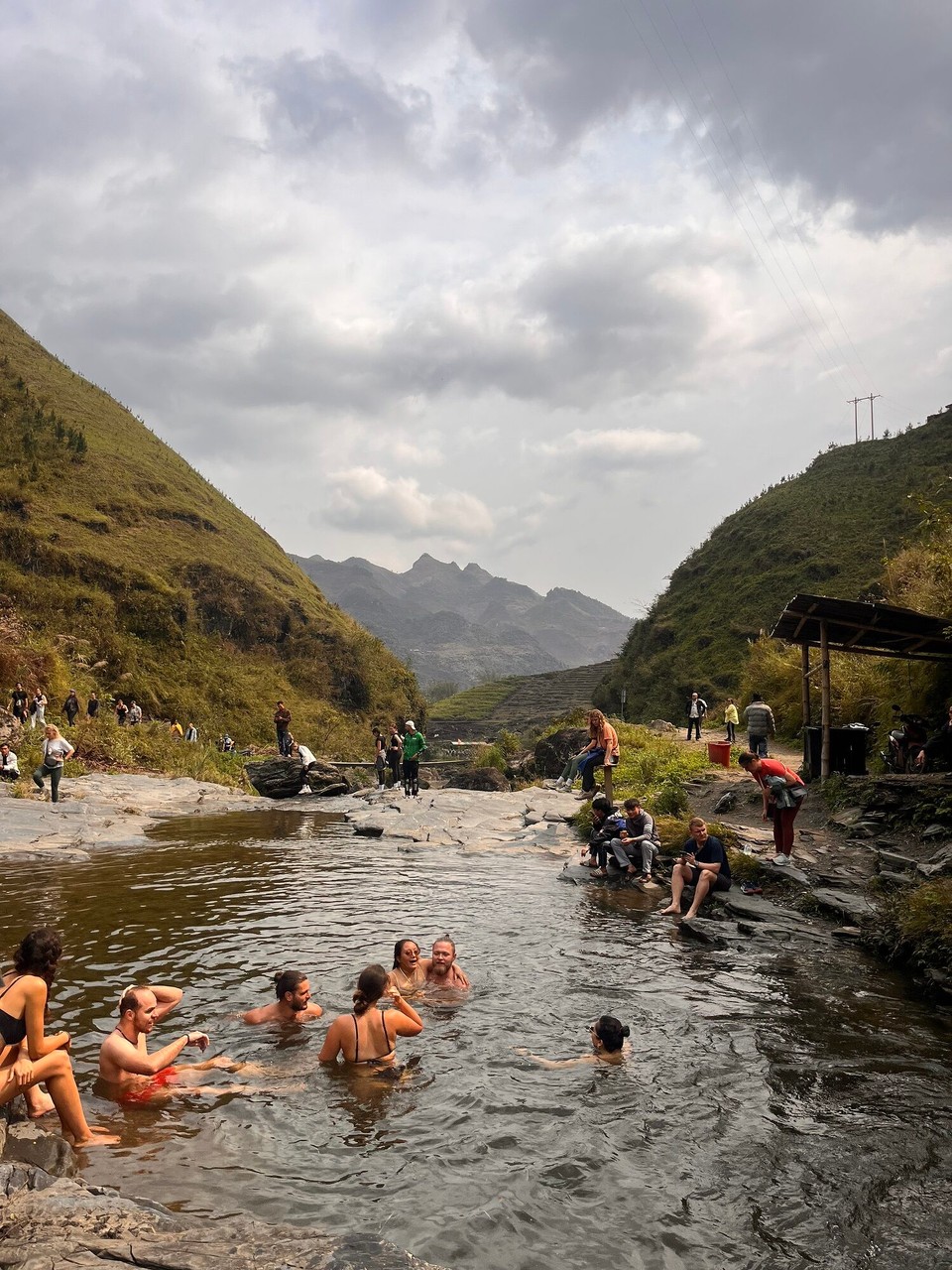 Vietnam - Ha Giang - People swimming in the water. It was so sweet we saw some Vietnamese children who were working dump all their stuff off their backs and run and jump in the water. They are actually really good swimmers which is surprising 