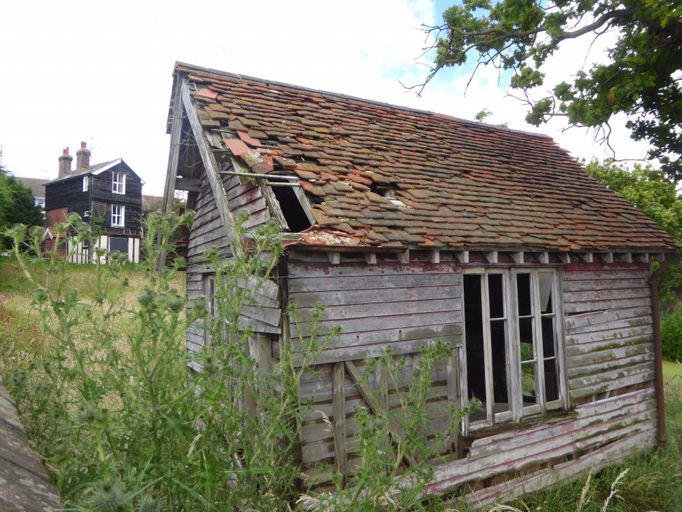 United Kingdom - Colchester - This house and shed look as though they’re going to be demolished to make way for flats on the shoreline - unless they fall down first. 