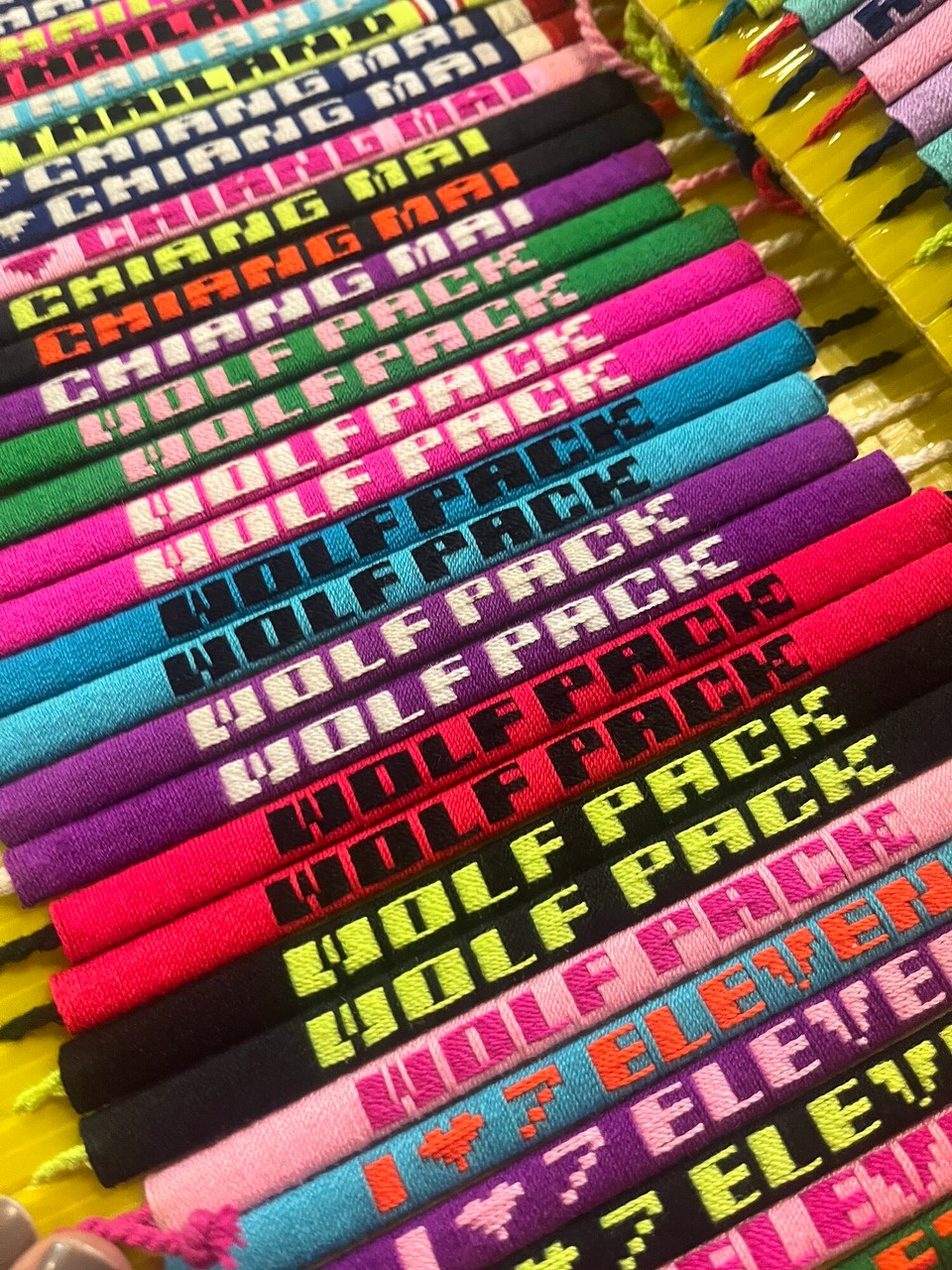 Thailand - Mueang Chiang Mai - After Stamps, we then went on to a pub crawl and I met Sam from Manchester in Zoe in Yellow club. These bracelets were on sale and the Wolfpack ones remind me of my friend group at home ❤️