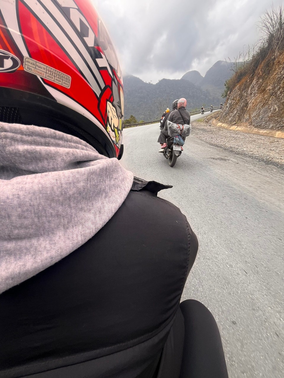 Vietnam - Ha Giang - Mink is my easy rider & he is so lovely - puts my helmet on for me and constantly looking out for those in our group who are driving themselves. He is only 20 and originally from Ha Giang so said he will make sure to show me all the local things 