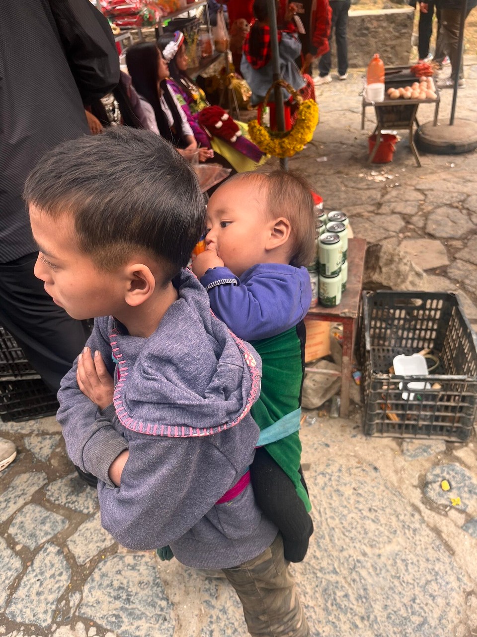 Vietnam - Ha Giang - An example of some of the kids walking around with babies on their back. There was also a man with a horse which he continuously brushed and it seemed to impress lots of the Vietnamese. I haven’t seen any horses out here so far so it seemed very out of place 