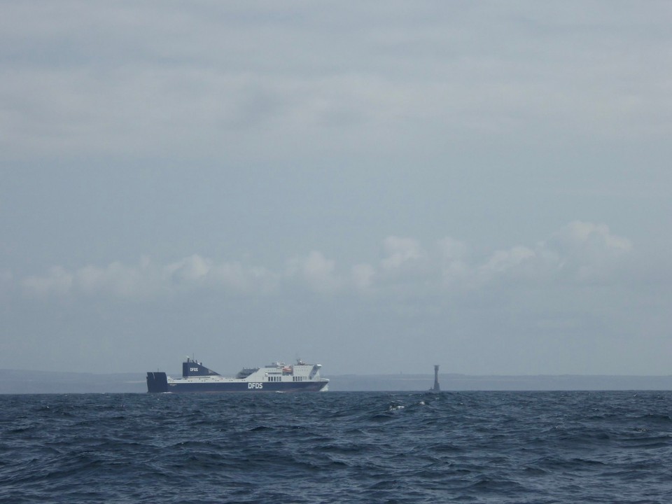 United Kingdom - Falmouth - DFDS Ro-Ro ferry passing Bishop Rock Lighthouse. Coming from Ireland and heading to the Netherlands. 
Bishop Rock Lighthouse was built by Trinity House in 1858—and further strengthened in 1887—to mark a rock ledge 46m long by 16m wide, four miles west of the Isles of Scilly.