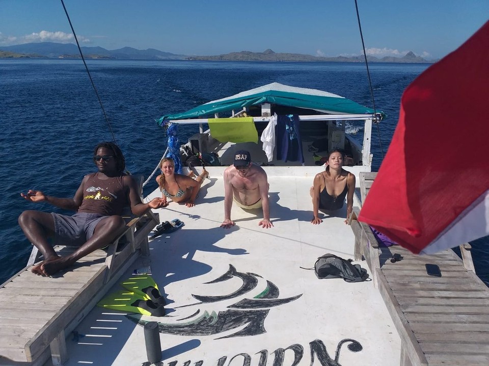 Indonesia - Labuan Bajo - I am not looking relaxed during yoga. Conditions weren’t easy with a slippery deck and shaking boat. 