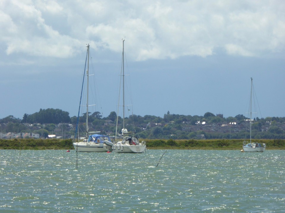 United Kingdom - Colchester - Avalon on her mooring buoy during a brief spell of sunshine.