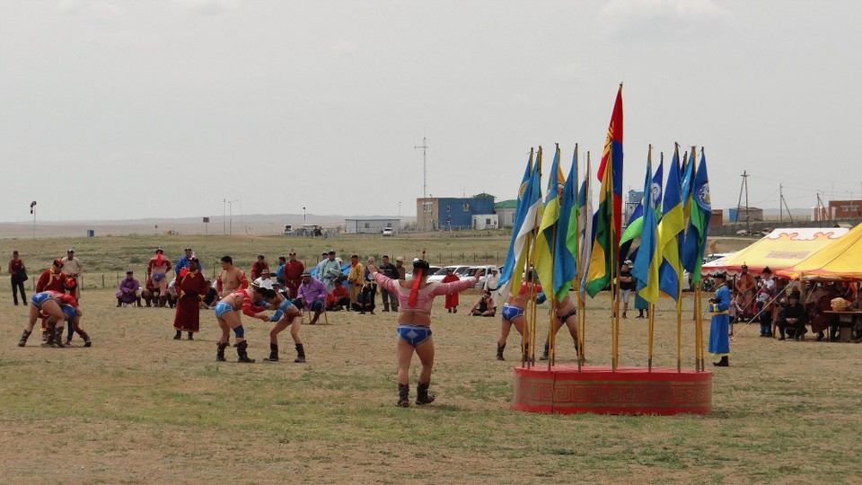 Mongolia - Mandalgovi - The winner circles the flags and flaps to represent the Garuda