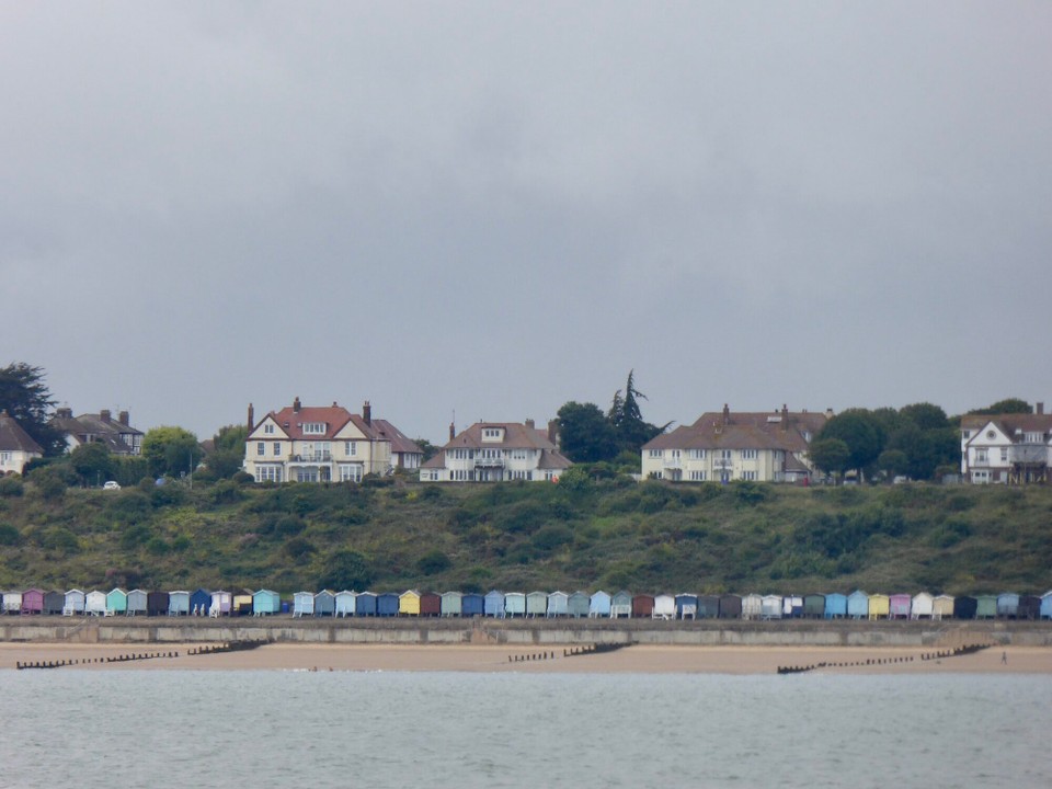 United Kingdom - Chelmsford - Spot the other bright part of the coastline today - Ginny came out to wave in her orange coat, even though she had no idea which was our boat.