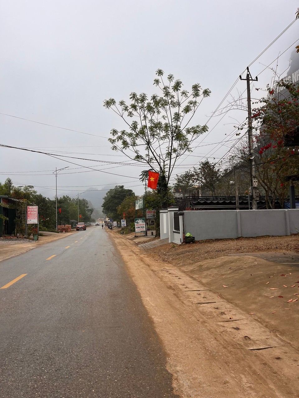 Vietnam - Bo Trach - Morning strolls to find some food. Foggy morning here but still 30 degrees