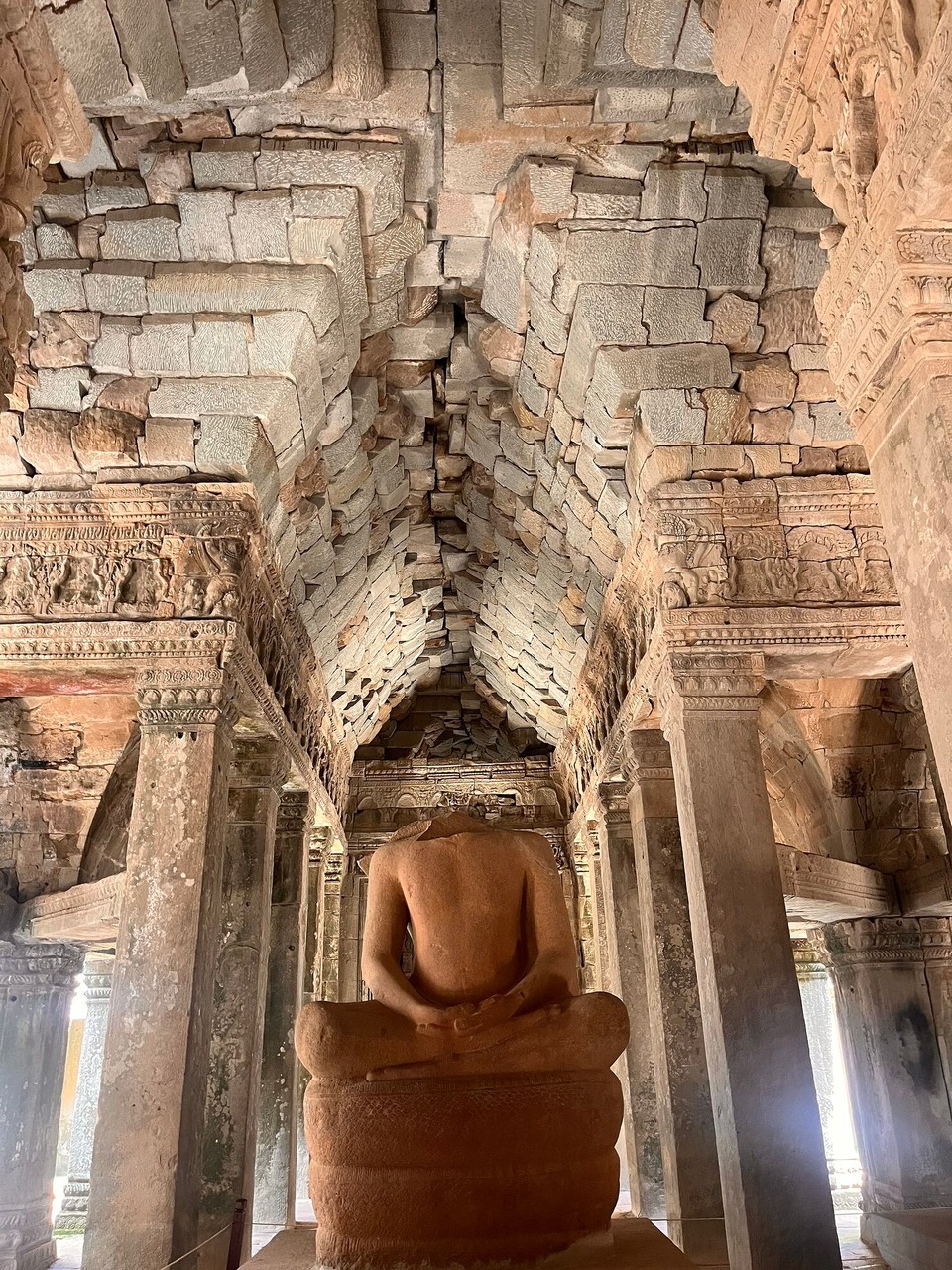 Cambodia - Siem Reap - Angkor wat was believed to be a Hindu temple when it was built and later converted to a Buddhist temple. It is believed that the Buddhas in the temples have no heads as they have been looted and sold for money. These could also have been destroyed during the unrest in Cambodia 