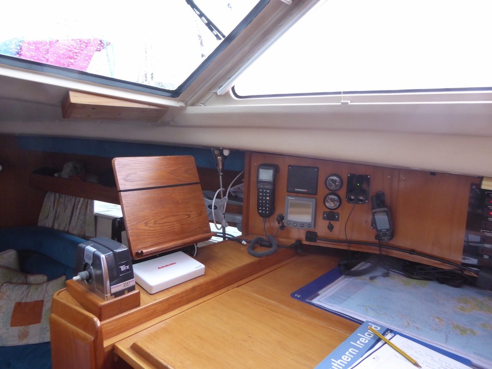 Ireland - Bere Island - There is an inside helm (the seat is accessed by lifting half the chart table). We have a small wheel and throttle that can be attached, but by using an iPad as a second screen we can steer the boat by using the autohelm.