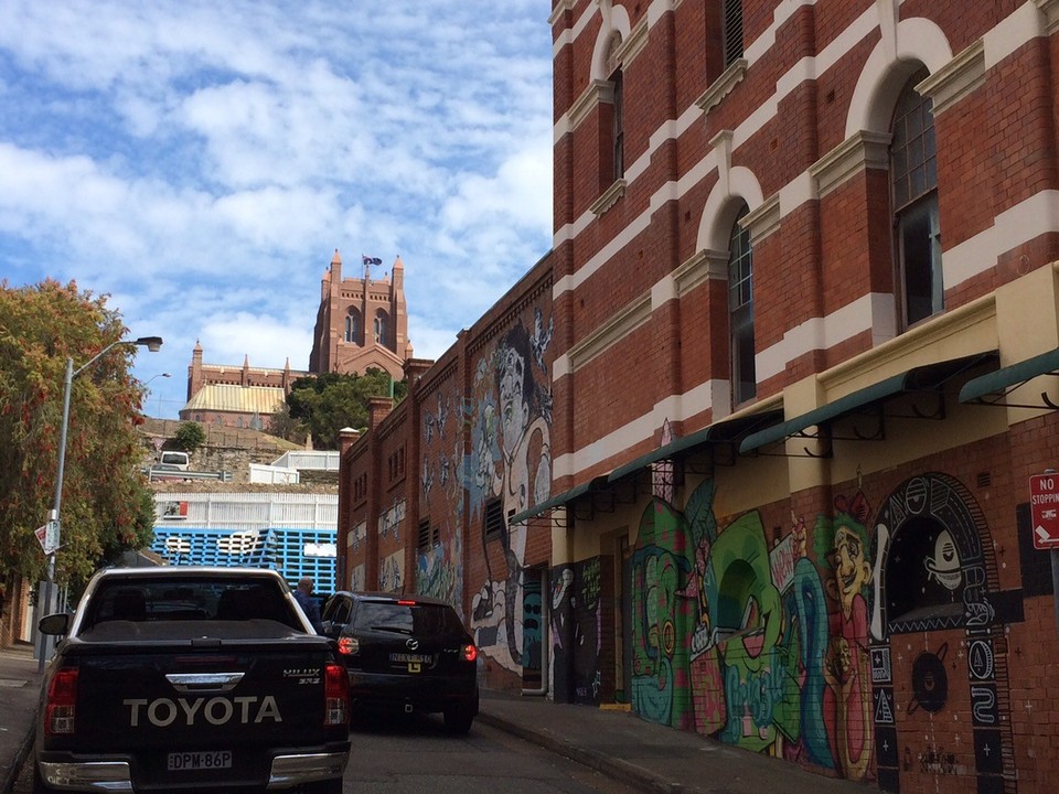 Australia - Newcastle - Street art with a church in the back. 