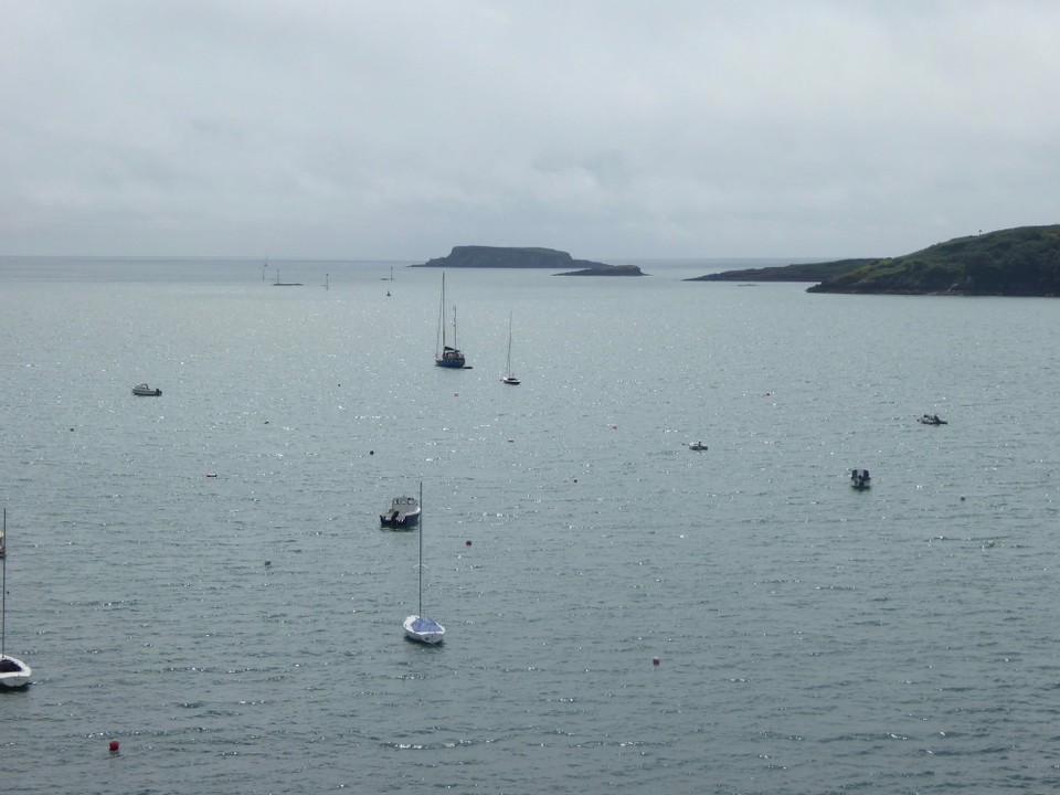 Ireland - Glandore - Glandore Harbour with Adam and Eve rocks in the distance, and the green navigation markers showing the route in.