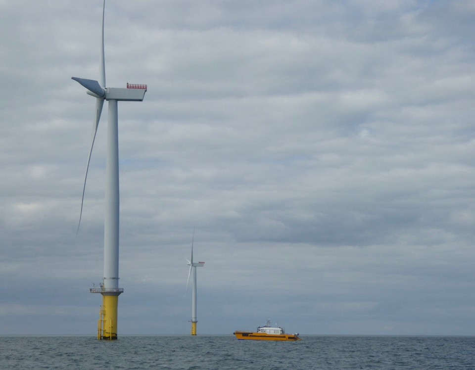 United Kingdom - Eastbourne - Work boats were buzzing between turbines as we traversed the wind farm. 
