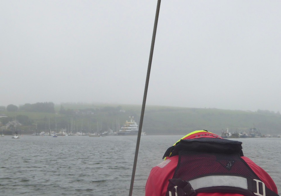 Ireland - Union Hall - Kevin stowing the fenders, having left at slack water. The tide can make it tricky manoeuvring in the marina.