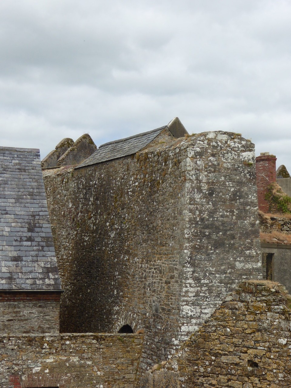 Ireland - Kinsale - A ‘blast wall’ was built to protect nearby buildings if there was an accidental explosion. The roof-like structure on top was designed to make the wall look like a building and detract from it being a target.