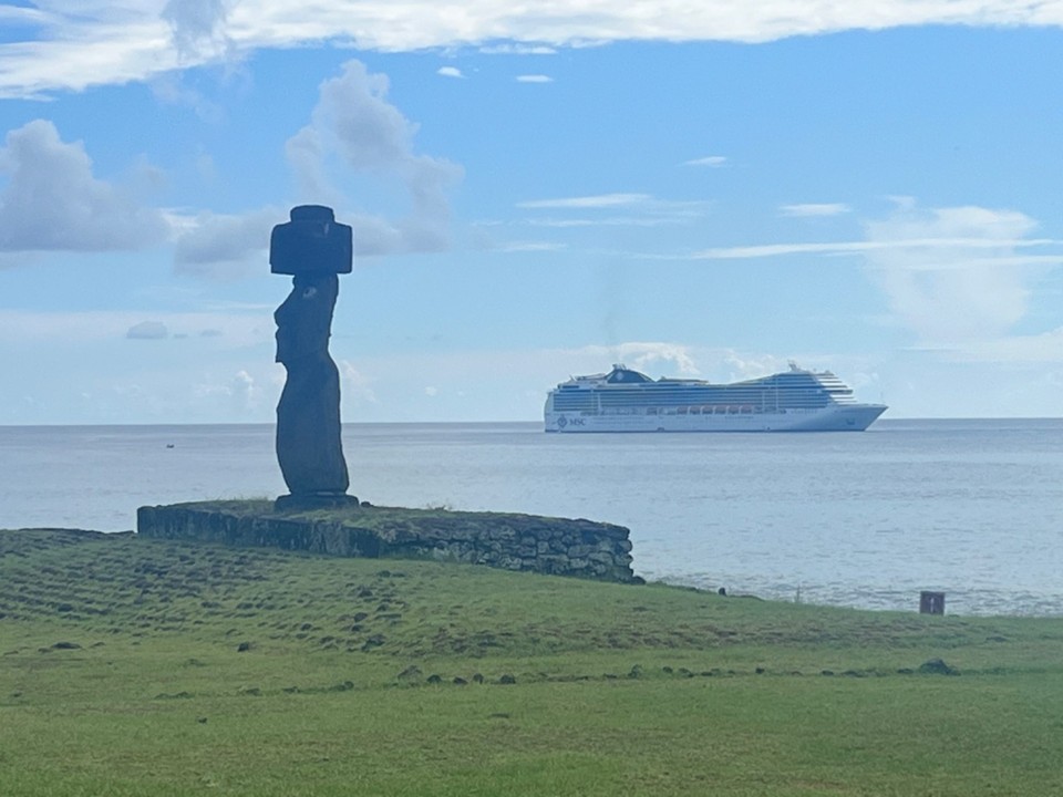 Chile - Easter Island - MSC cruise liner behind one of the Hanga Roa Moai 