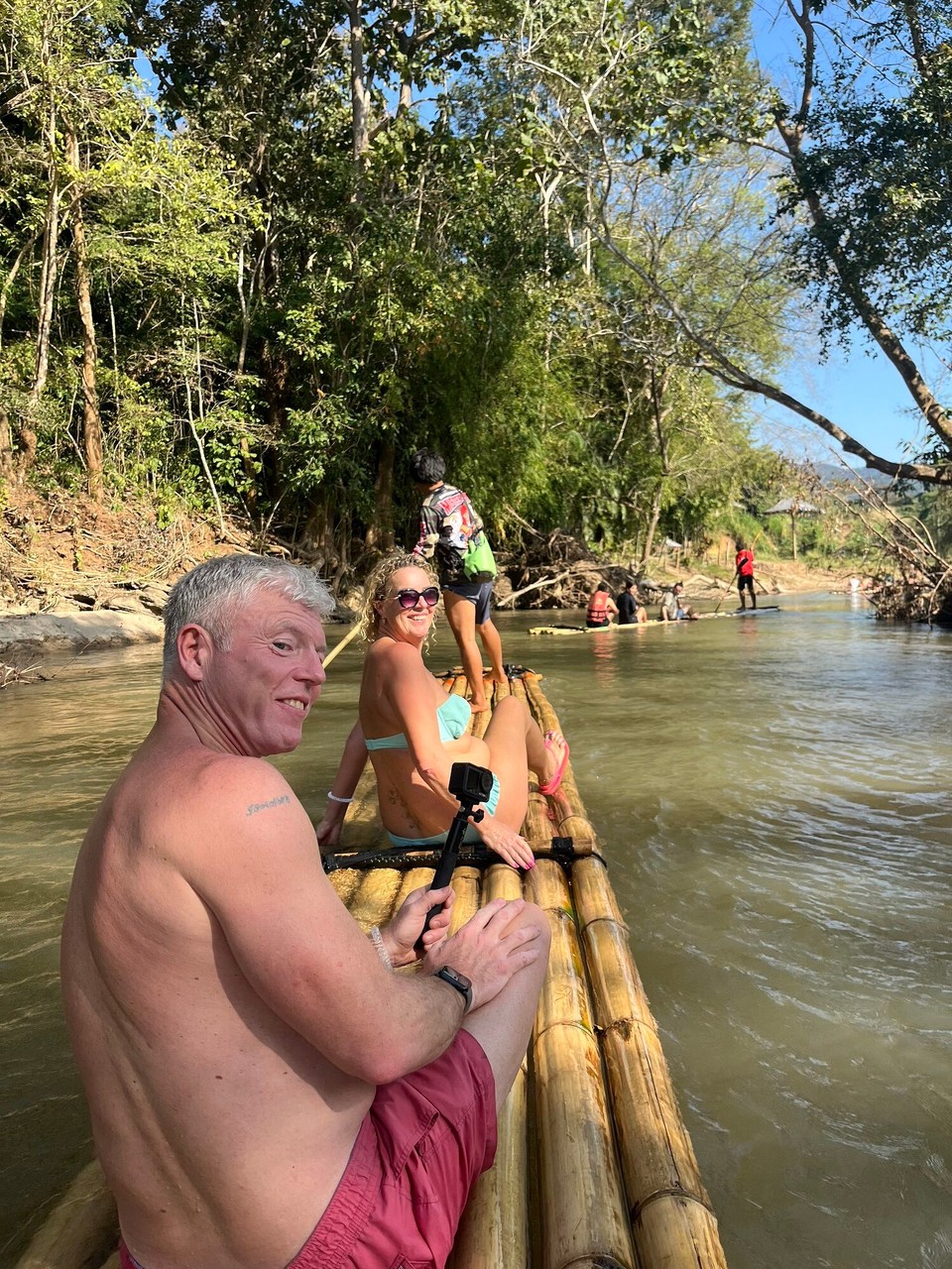 Thailand - Mueang Chiang Mai - Lastly, we went bamboo rafting down the river in the sanctuary where you can see the elephants on your way round. Jo and John were a couple I met on the tour who let me go on their raft with them. It was so funny bcos the man kept pretending to push us off but we didn’t fall in thank god!