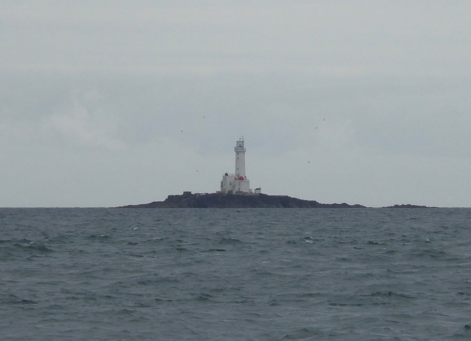 Ireland - Kilmore Quay - The lighthouse on Tuskar Rock.  The little islands at the top and bottom are called North and South Hen and Chickens.