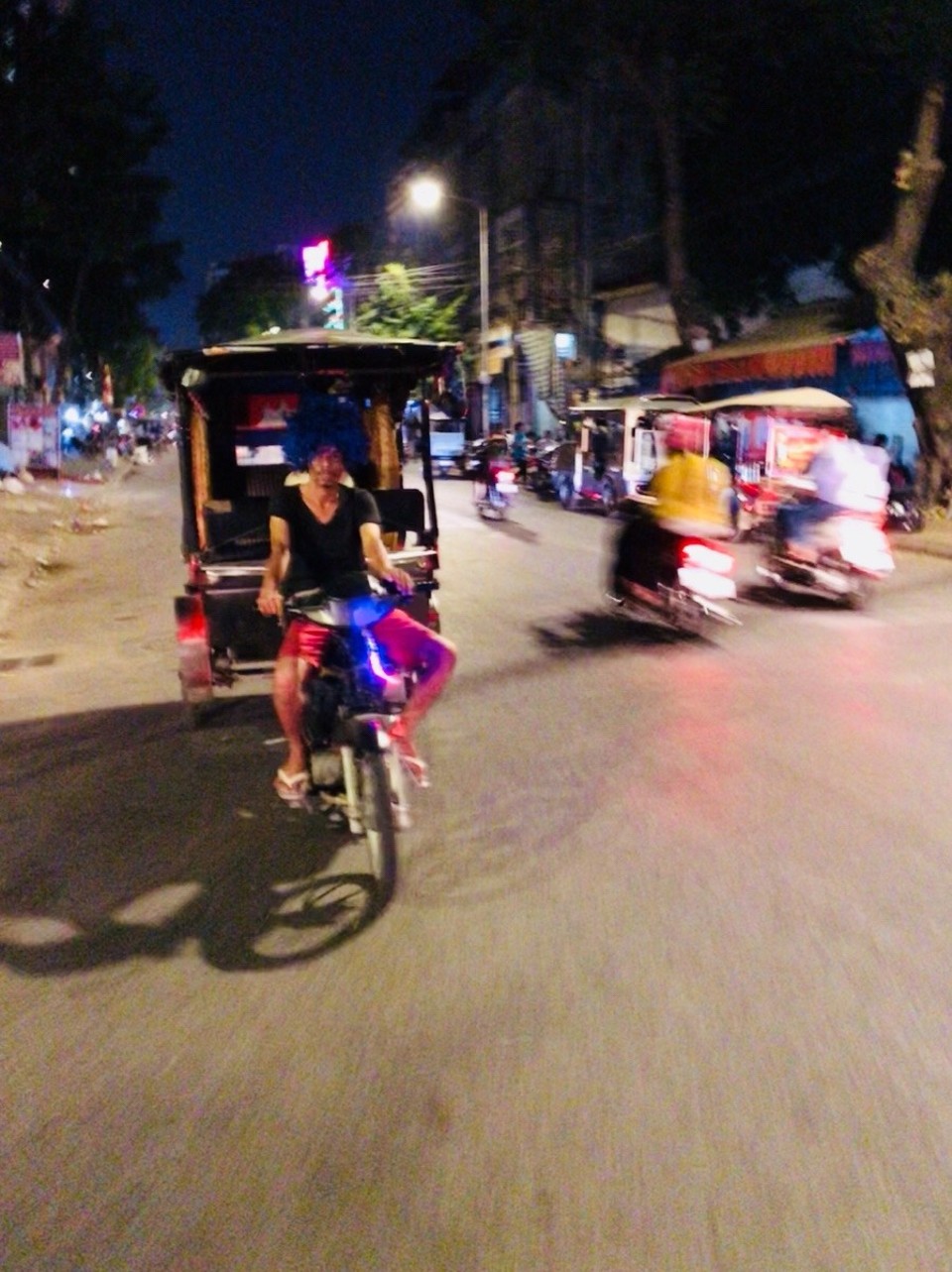 Cambodia - Phnom Penh - Am I in Brazil? I might be, judging by this colourful tuktuk driver