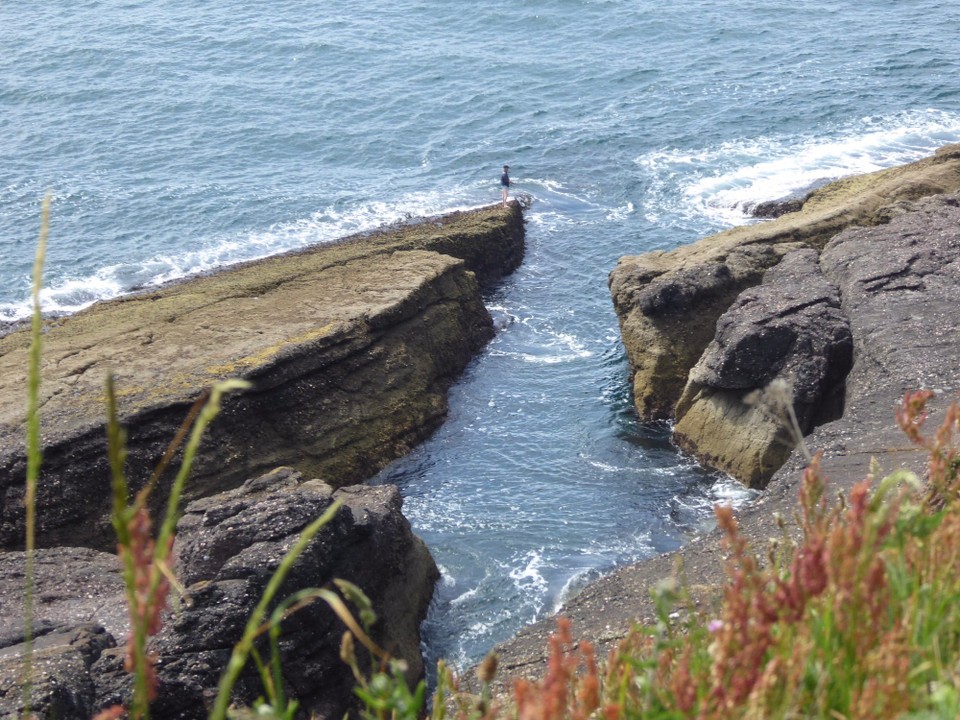 Ireland - Dunmore East - ‘Extreme’ angling seems popular; some people scrambling down the cliff face, rods in hand, to stand on the edge of the rocks.